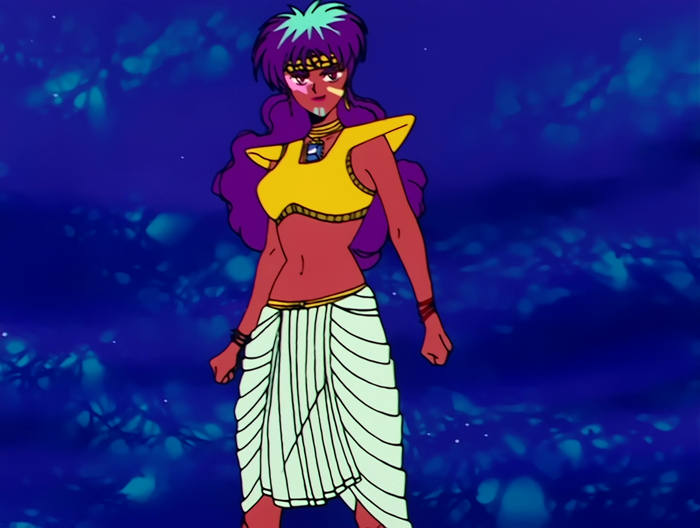 Udering, a Droid from Sailor Moon episode 77. She has brown skin and long purple hair. She’s wearing a white wrap skirt and a yellow top and headband. She’s also wearing a bunch of bracelets, and I usually don’t mention stuff like this but it’s kind of her whole deal. She also pink, yellow and blue shapes painted on her face.